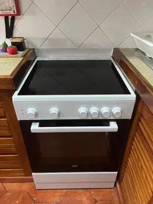 a white stove top oven in a kitchen at Sea Light Seaview Vista Mar Apartment - Luz, Lagos in Luz