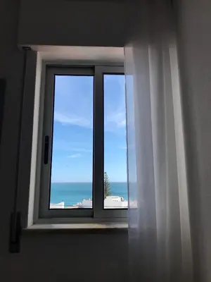 a window with a view of the ocean at Sea Light Seaview Vista Mar Apartment - Luz, Lagos in Luz