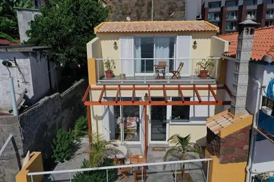 an aerial view of a house with a balcony at maktub sunset property in Paul do Mar
