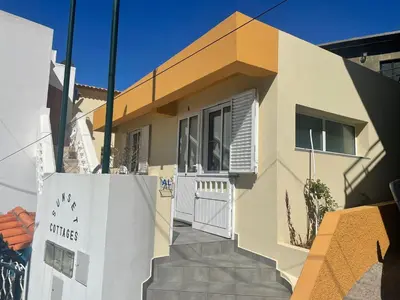 a house with a sign in front of it at maktub sunset property in Paul do Mar
