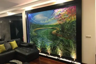 a living room with a large painting on the wall at Ammy’s House in Câmara de Lobos