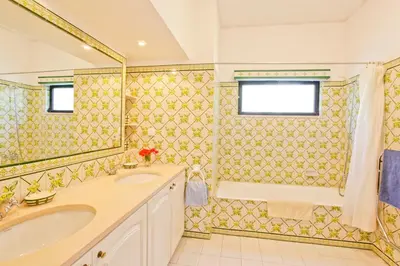 a bathroom with a sink and a tub and a shower at Casa dos Cardos in Luz