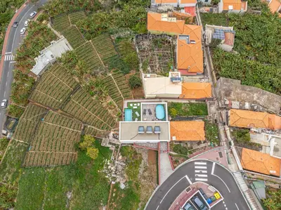 an aerial view of a house with a road at GuestReady - Sonho dos Avós in Câmara de Lobos