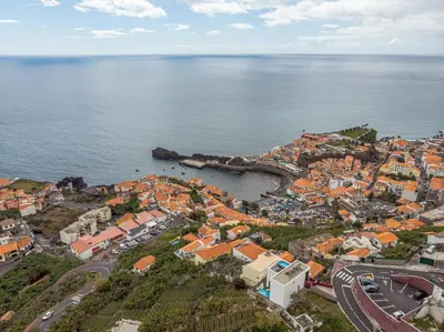an aerial view of a town next to the water at GuestReady - Sonho dos Avós in Câmara de Lobos