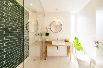 a bathroom with a sink and a mirror at Casa Vica - Sagres Apartments in Sagres