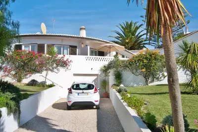 a white car parked in front of a house at Casa Catryn in Luz