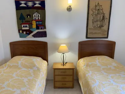 two beds sitting next to each other in a room at Casa Catryn in Luz