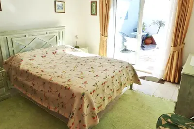 a bedroom with a bed with a blanket on it at Casa Catryn in Luz