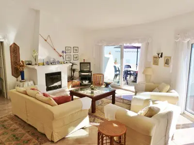 a living room with two couches and a fireplace at Casa Catryn in Luz