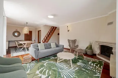 a living room with a couch and a table at Reis Magos V by An Island Apart in Caniço