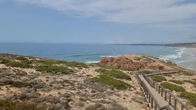 a view of the ocean from the top of a hill at Casa Chic in Vila do Bispo