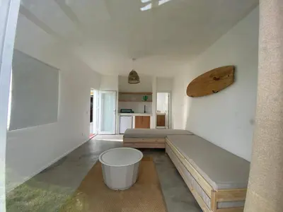 a living room with a couch and a table at Arrifana Beach Break in Aljezur