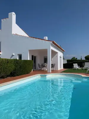 a swimming pool in front of a villa at Casa Colina, walking distance to Arrifana Beach in Aljezur