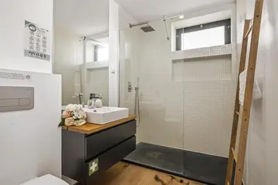 a bathroom with a sink and a shower at Funchal Tropical Apartments by Homie in Funchal