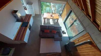an overhead view of a living room with a couch and a table at Casa Pereirinha in Estreito da Calheta
