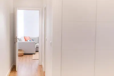 a hallway with a door leading to a living room at Apartamentos Fernão de Ornelas by Heart of Funchal in Funchal