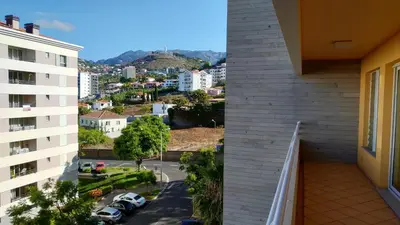 a view of a city from a balcony of a building at Green Park Ajuda Apartment in Funchal