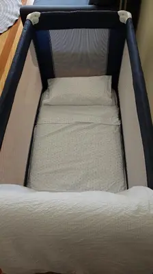 a bed frame with two white pillows on it at Green Park Ajuda Apartment in Funchal
