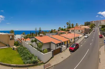 a street in a suburb with houses and a road at Terrace Vila by An Island Apart in Caniço