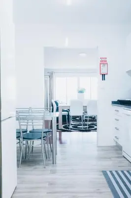 a kitchen and dining room with a table and chairs at Dorisol Vista Formosa by rentallido in Funchal