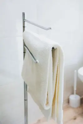 a towel rack with white towels hanging on it at Dorisol Vista Formosa by rentallido in Funchal