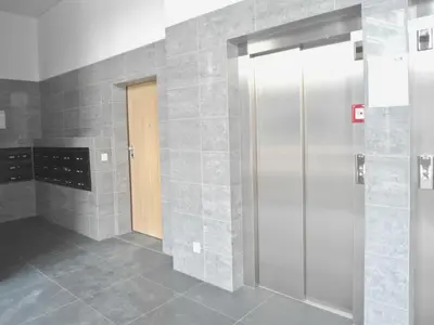 a bathroom with a walk in shower and a door at Town Apartment in Funchal