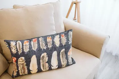 a pillow sitting on a chair in a living room at Os Fragosinhos by Amazing Madeira in Funchal