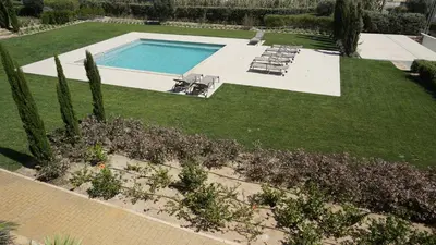 an aerial view of a yard with a swimming pool at Apartamento 7 Mares com Suite in Sagres