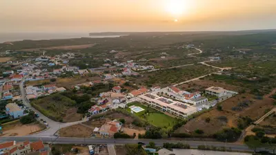 an aerial view of a town at sunset at Apartamento 7 Mares com Suite in Sagres