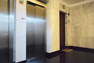 a elevator in a building with a wall at Design Gardens, a Home in Madeira in Funchal