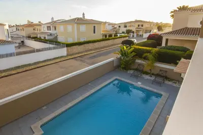 a swimming pool on the side of a house at D09 - Porto de Mos Luxury Villa in Lagos