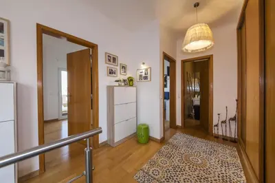 a room with a hallway with a door and a rug at D09 - Porto de Mos Luxury Villa in Lagos