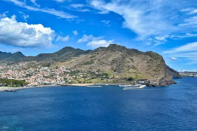 a view of a small island in the water at Machico Beach, a Home in Madeira in Machico