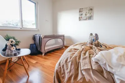 a bedroom with a bed and a tv in it at Trendy Apartments in Funchal