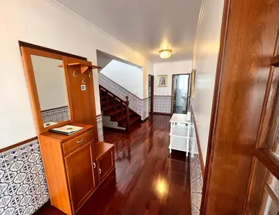 a hallway of a home with a staircase and a mirror at Classic Tranquil Madeiran 4-Bedroom Villa Funchal in Funchal