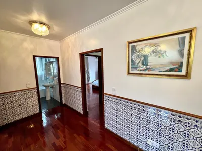 an empty room with a painting on the wall at Classic Tranquil Madeiran 4-Bedroom Villa Funchal in Funchal