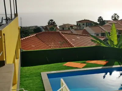 a view from the balcony of a house with a swimming pool at CASA DOS AVÓS Apartments with Pool in Funchal in Funchal