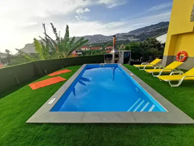 a swimming pool on the roof of a house at CASA DOS AVÓS Apartments with Pool in Funchal in Funchal