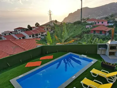 a swimming pool on the roof of a house at CASA DOS AVÓS Apartments with Pool in Funchal in Funchal