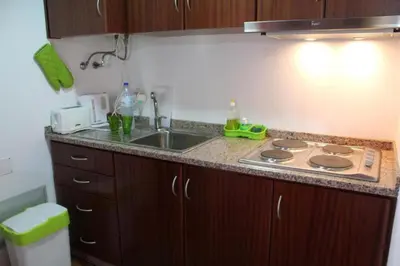 a kitchen with a sink and a stove in it at Zef's Cottage in São Vicente