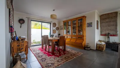 a dining room with a table and a window at The Goat's Place in Gaula