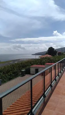 a balcony with a view of the beach and the ocean at Villas Madalena Chalets vista mar cWiFi in Santa Cruz