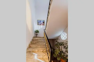 a staircase in a house with wooden floors at City View Gardens in Funchal
