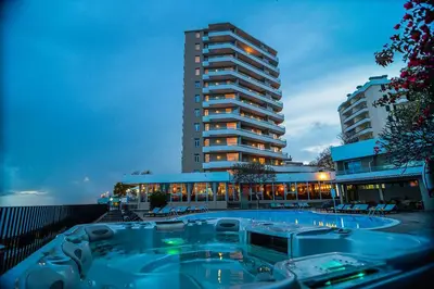a building with a hot tub in front of a building at Golden Sea Horizon in Funchal