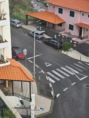an aerial view of a parking lot with cars parked at Ocean Breeze in Caniço