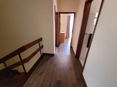 an empty hallway with a stairway leading to a room at Casa Alegria in Funchal