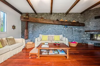 a living room with a couch and a table at Lajesol in Seixal