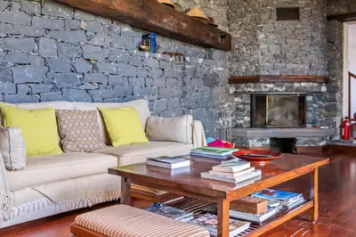 a living room with a couch and a coffee table at Lajesol in Seixal