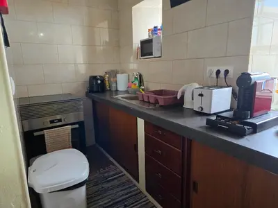 a small kitchen with a sink and a toilet at casa Eira Alta in Santa Bárbara