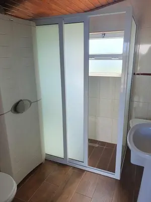a bathroom with a toilet and a sink at casa Eira Alta in Santa Bárbara